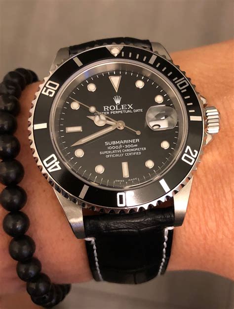 rolex submariner with black leather strap|Rolex Submariner ceramic curved strap.